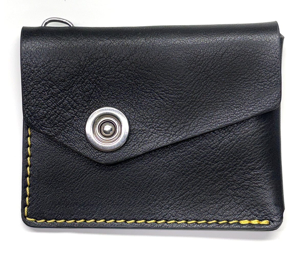 Black milled leather CODA asymmetric wallet.