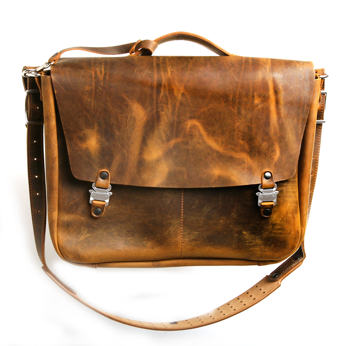 Bacula Messenger bag in full leather construction (structured black leather, pull-up and smooth finish), reinforced with military-grade quick-release buckles and gunmetal rivets at stress points, interior compartment