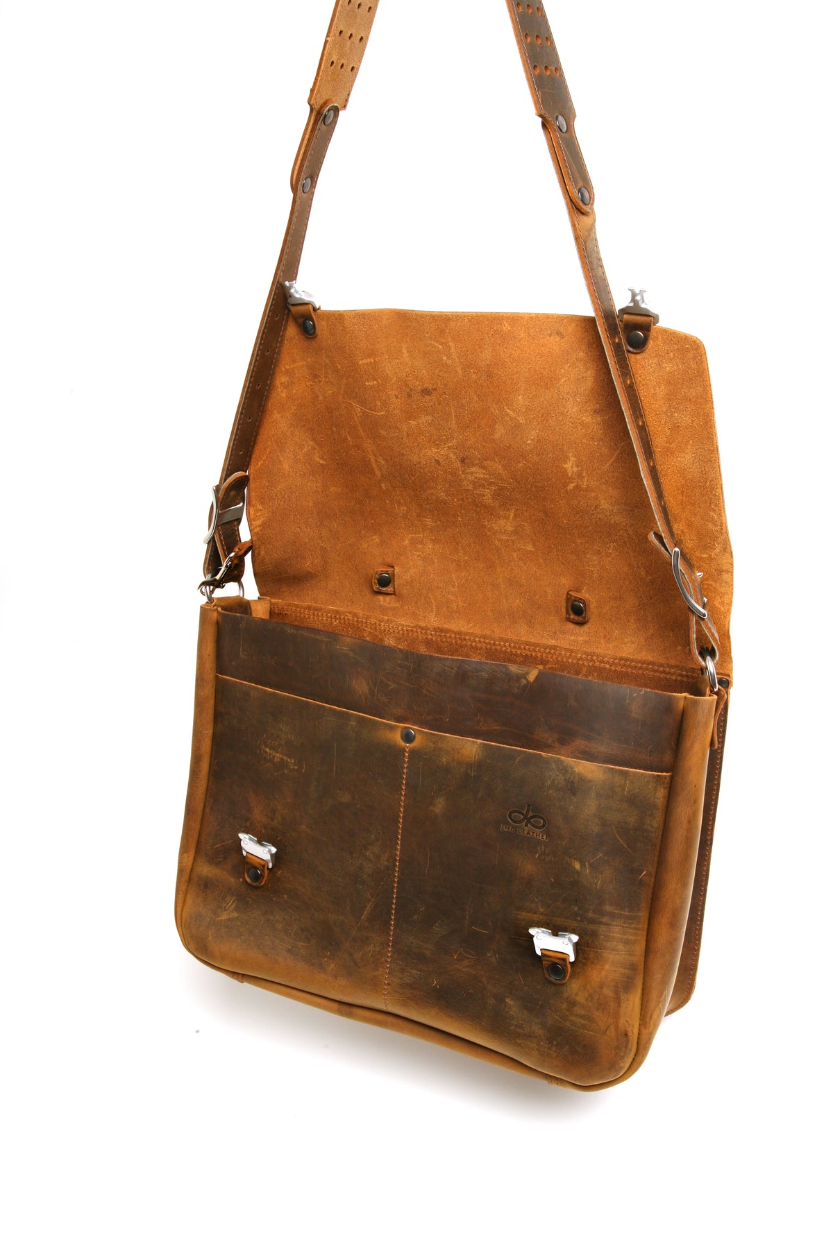 Bacula Messenger bag in full leather construction (structured black leather, pull-up and smooth finish), reinforced with military-grade quick-release buckles and gunmetal rivets at stress points, strap detail