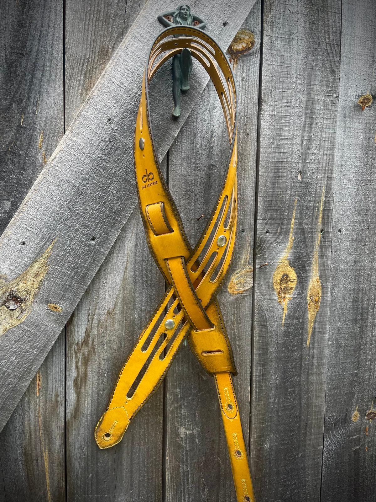 Vintage Guitar strap channel Burnt Thistle in vegetable-tanned leather, burnished edges, laid flat, full length