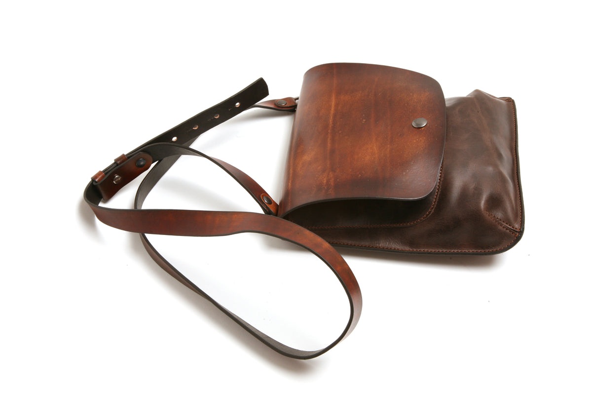 ROSCO satchel bag in vegetable-tanned leather (flap) with softer leather (main body), back view