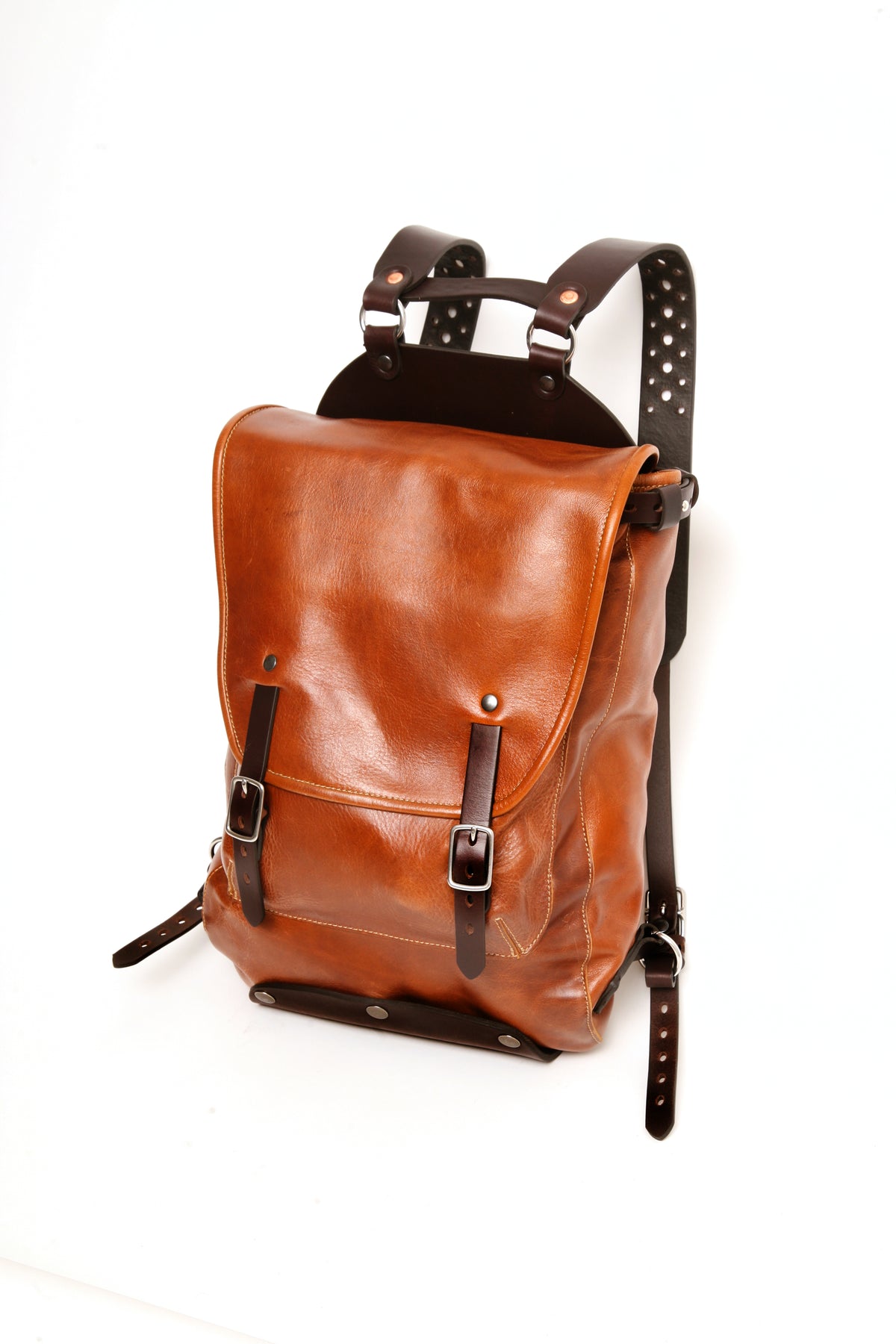 Leather backpack in vintage brown buffalo leather, front and side view