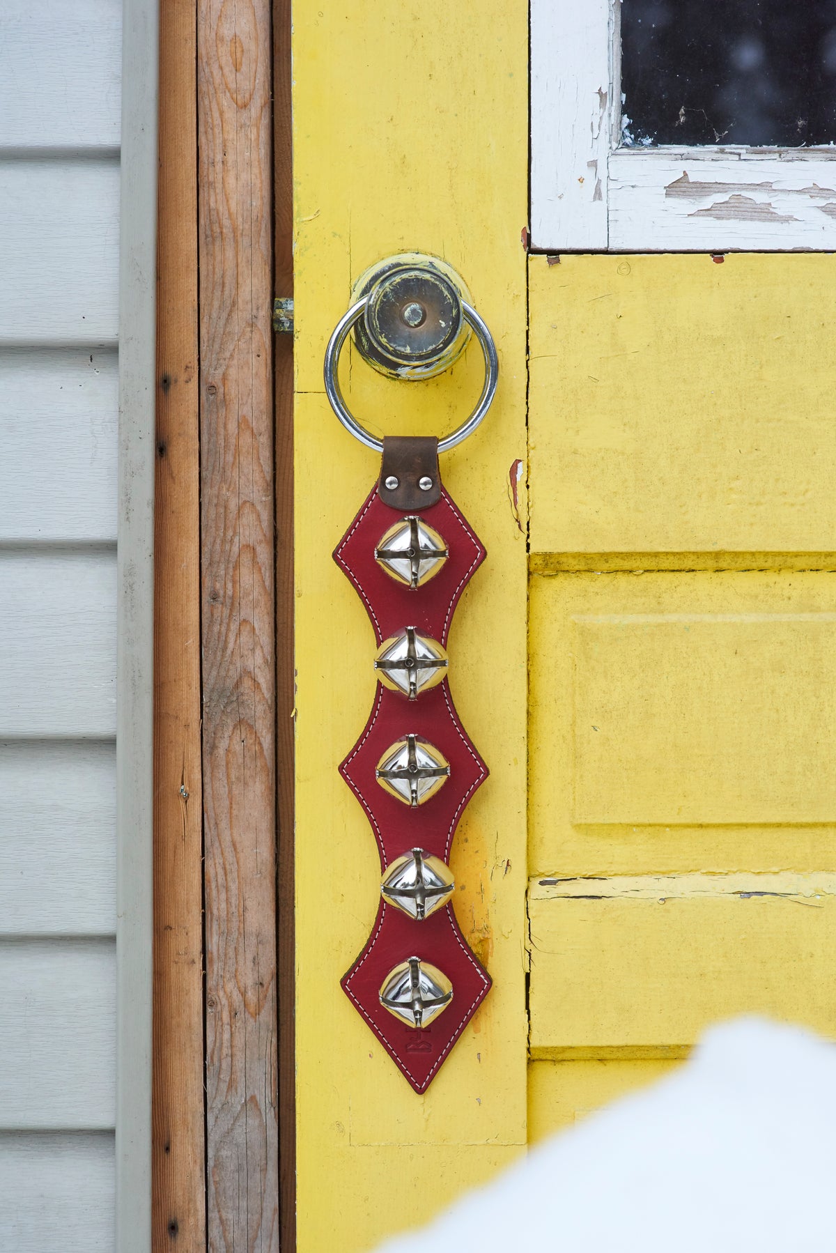 CARILLON leather door bell hanger, back view showing the protective pad over the rivets