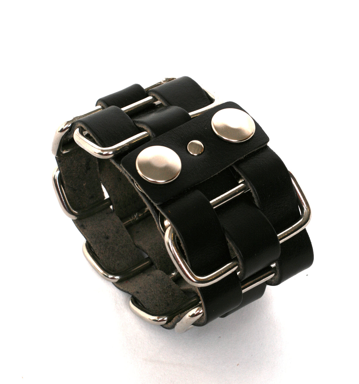 Cholo stainless-steel cuff in vegetable-tanned leather woven through welded solid stainless-steel loops, leather texture detail