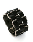 Cholo stainless-steel cuff in vegetable-tanned leather woven through welded solid stainless-steel loops, side view