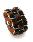 Cholo stainless-steel cuff in vegetable-tanned leather woven through welded solid stainless-steel loops, front view