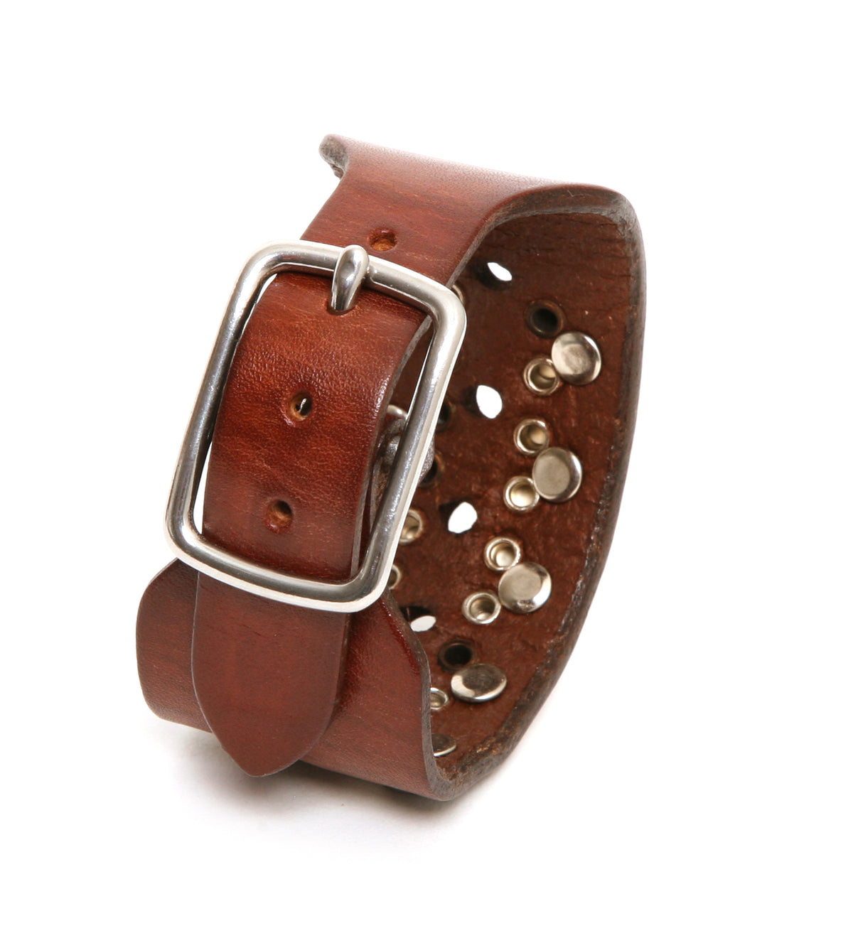 Classic buckle cuff studded in 8oz English bridle leather with studs and a stainless steel buckle with stainless-steel hardware, close-up detail