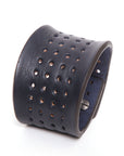 Contour perforated cuff medium brown in 8-9oz English bridle leather with stainless-steel hardware, close-up detail