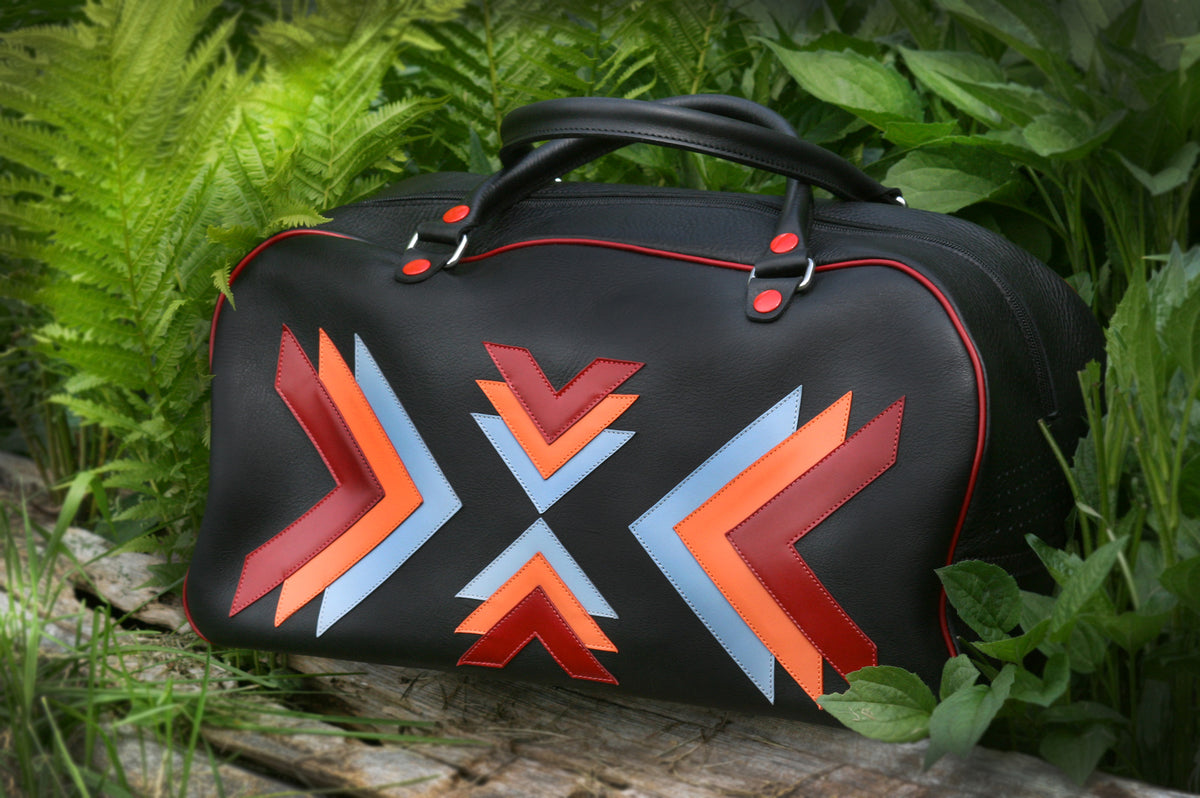 Duffel Bag black with design in tan vegetable-tanned leather with smoked chrome details, front view