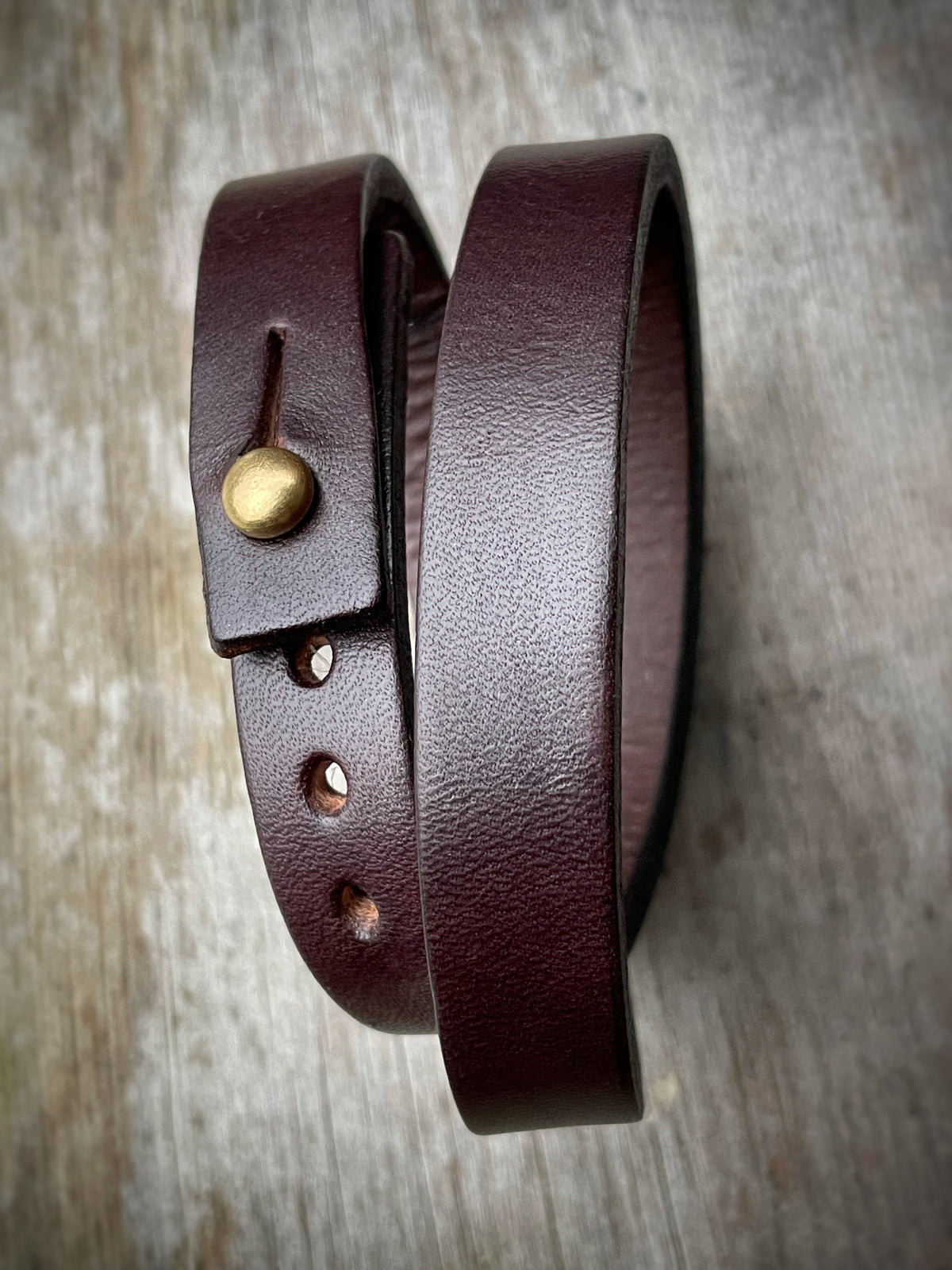 Double wrap cuff in 8oz English bridle leather with stainless-steel hardware, further detail view