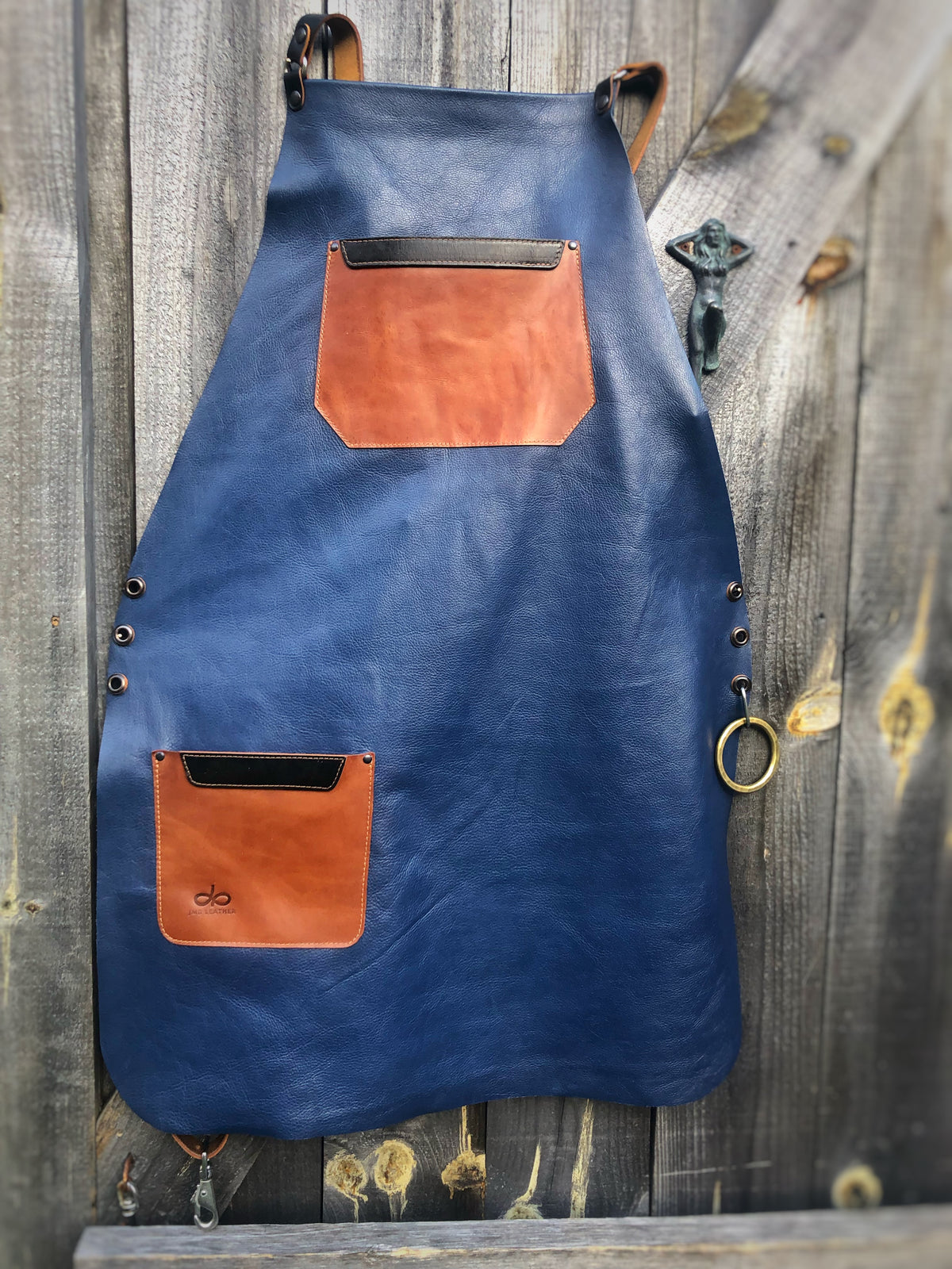 Leather Apron blue and tan in top-grain leather (single panel, no seams), front view
