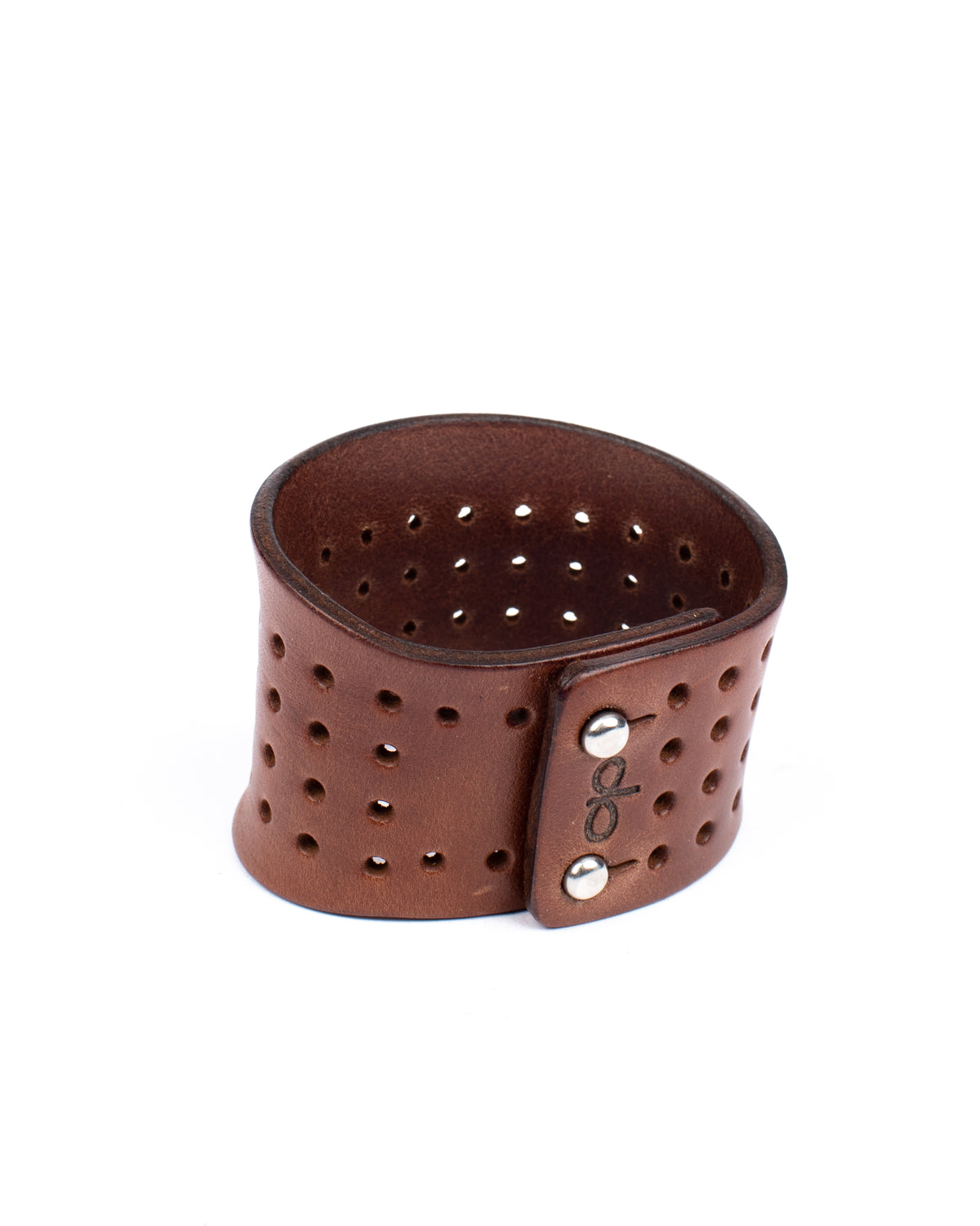 Contour perforated cuff medium brown in 8-9oz English bridle leather, leather texture detail