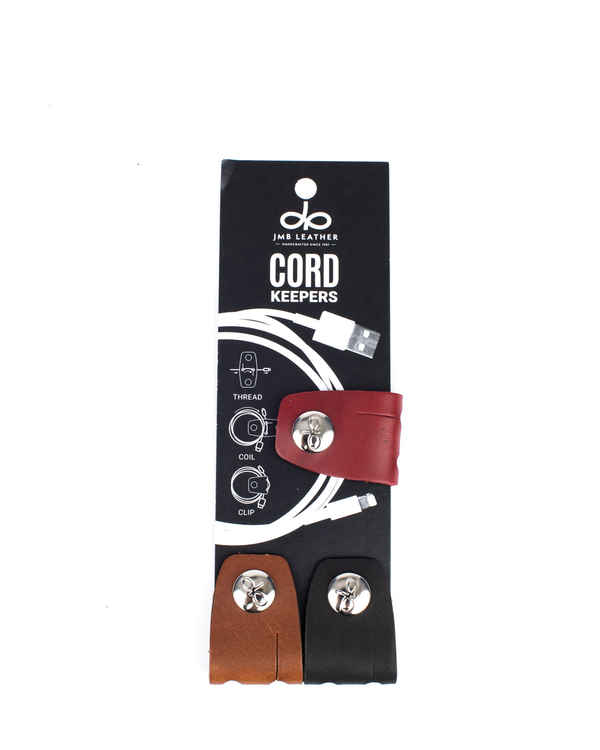 Cord Keepers in 100% full-grain leather with brass hardware, close-up detail