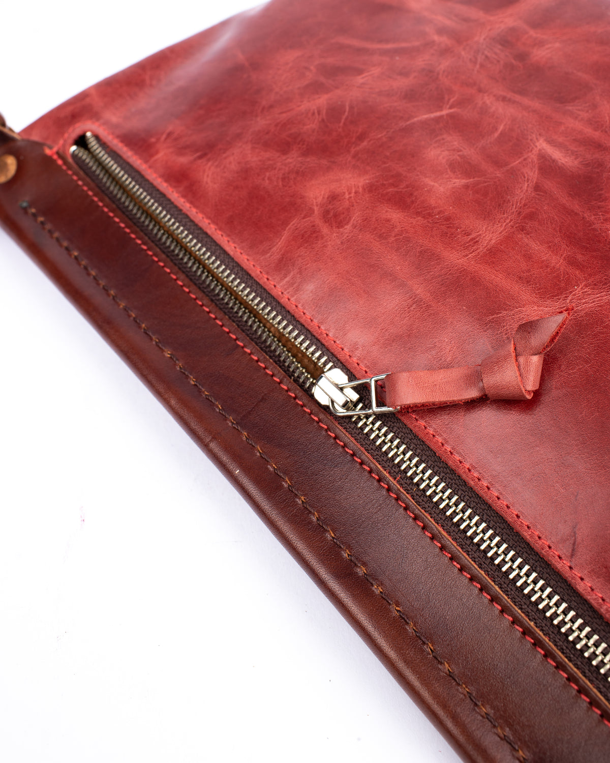 Flat sling vintage tan & turquoise bag in vegetable-tanned leather combined with softer leather, side view