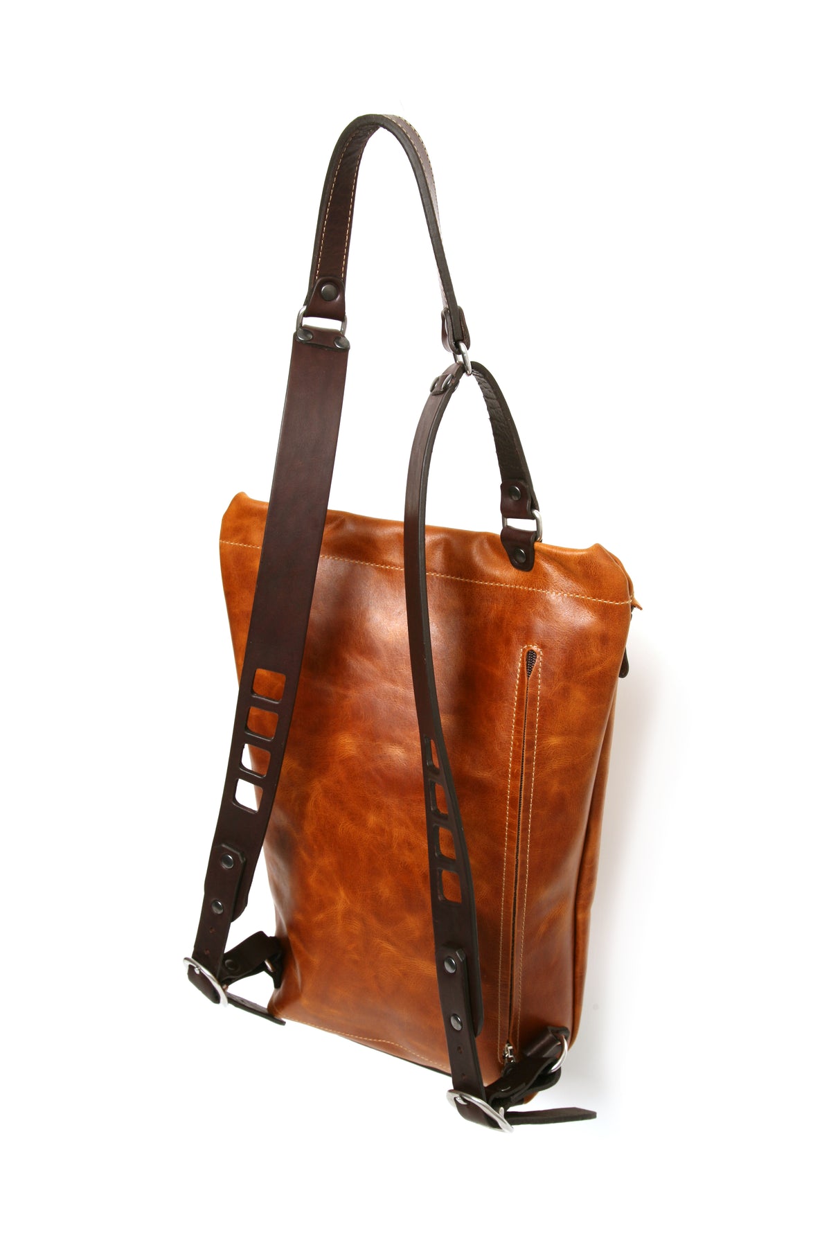 YETI leather sling pack in vintage tan, profile view
