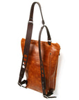 YETI leather sling pack in vintage tan, profile view